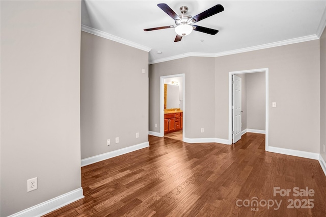 unfurnished bedroom featuring connected bathroom, ceiling fan, crown molding, and dark wood-type flooring