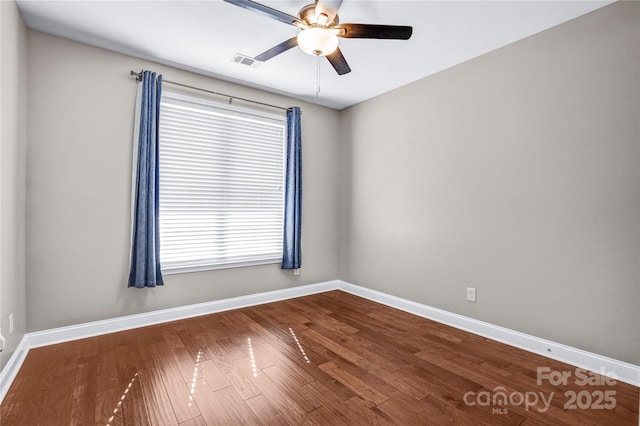 empty room featuring ceiling fan and hardwood / wood-style flooring