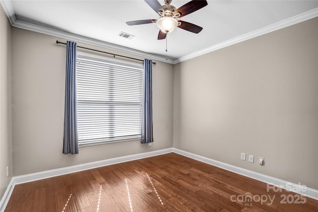 empty room with ornamental molding, ceiling fan, and wood-type flooring