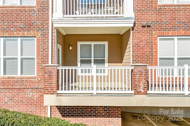 property entrance with a balcony