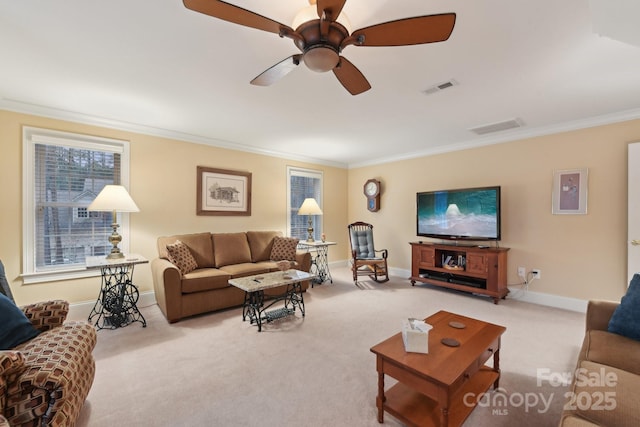 living room featuring light carpet, ceiling fan, and crown molding