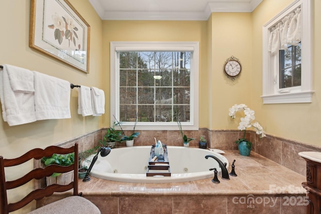 bathroom featuring tiled tub and crown molding