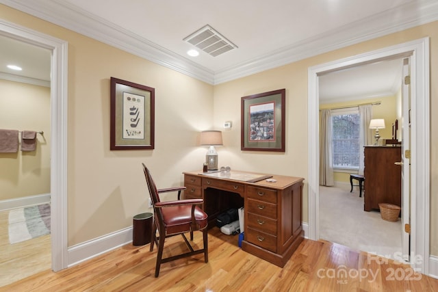 office area with light hardwood / wood-style floors and crown molding