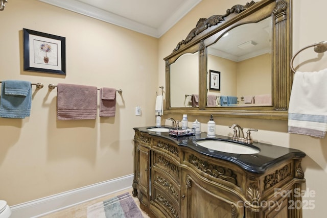 bathroom with vanity and ornamental molding