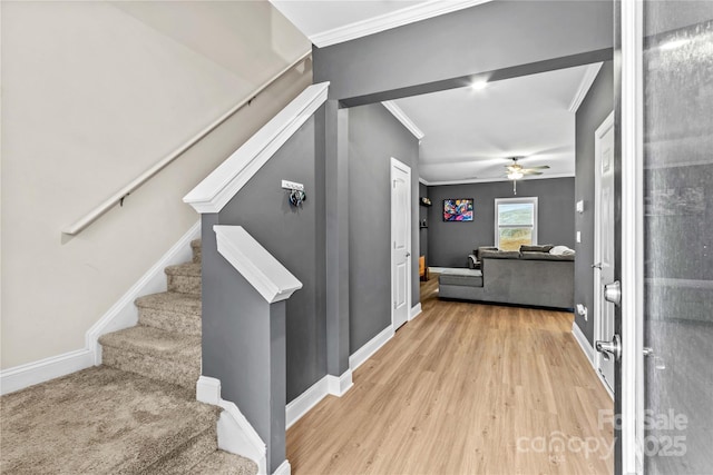 interior space with light wood-type flooring and crown molding