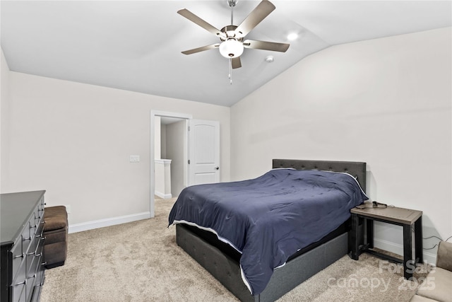 carpeted bedroom featuring ceiling fan and vaulted ceiling