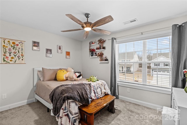 bedroom featuring ceiling fan and light colored carpet