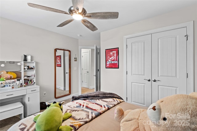 bedroom featuring ceiling fan and a closet