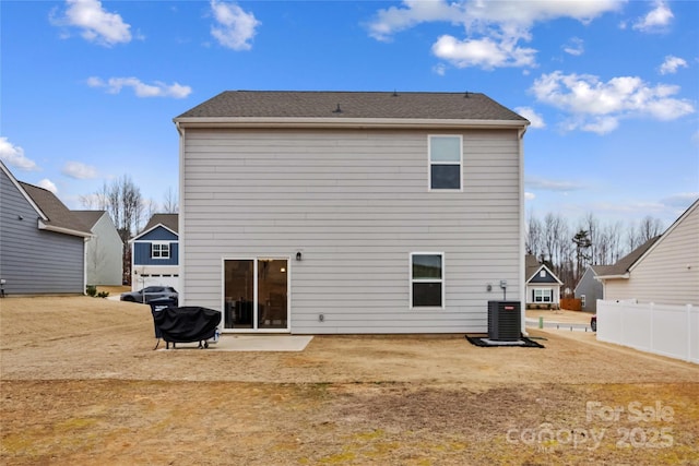 rear view of house featuring central AC and a patio