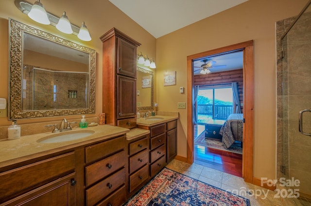 bathroom featuring tile patterned floors, vanity, and an enclosed shower