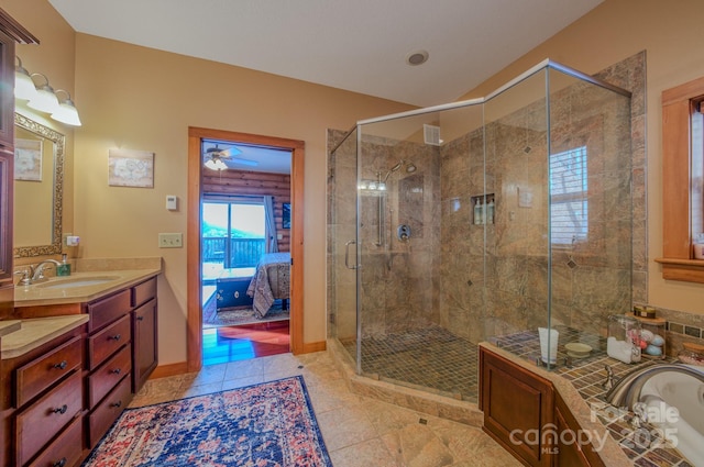 bathroom with walk in shower, tile patterned floors, and vanity