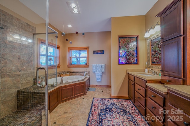 bathroom featuring separate shower and tub and vanity