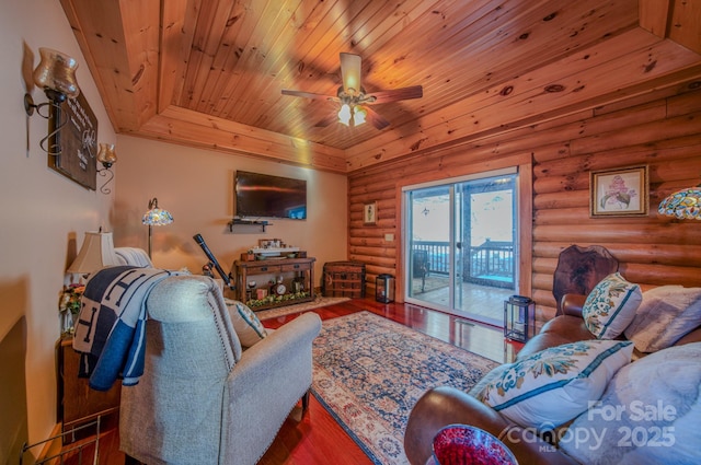 living room with ceiling fan, wooden ceiling, wood-type flooring, and rustic walls