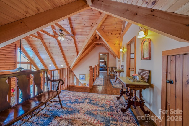 additional living space featuring hardwood / wood-style floors, rustic walls, lofted ceiling with beams, and wood ceiling