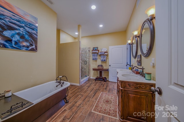 bathroom featuring vanity and plus walk in shower