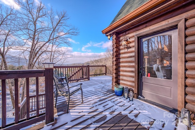 view of snow covered deck