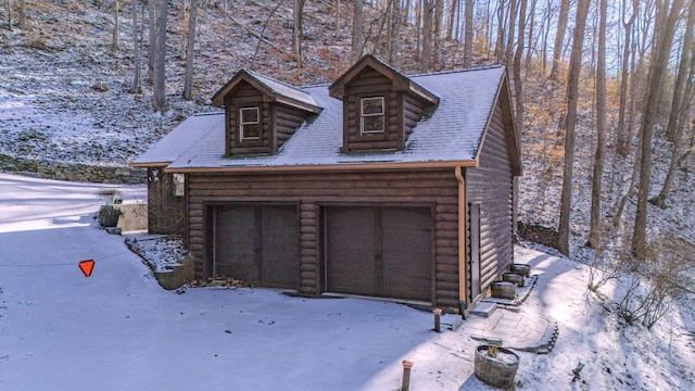 view of snow covered garage