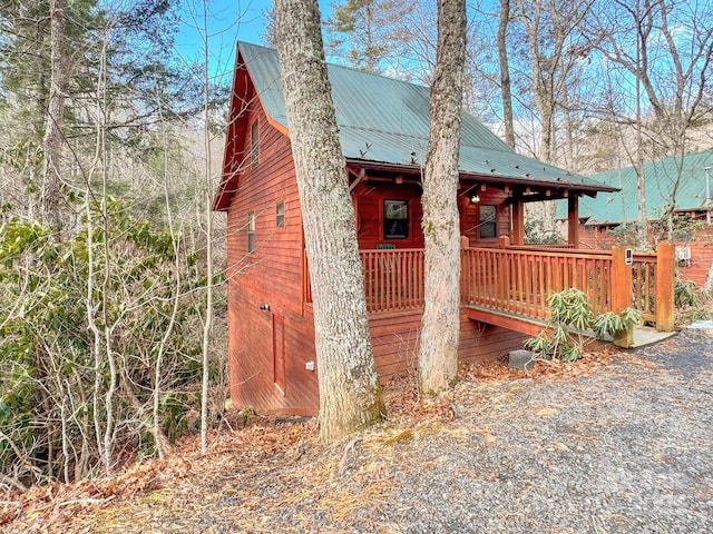 view of side of property featuring a porch