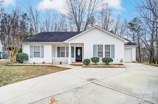 ranch-style home featuring a porch and a garage