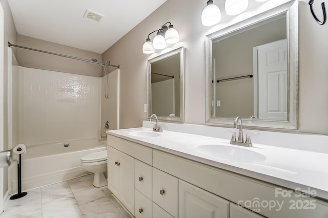 full bathroom featuring vanity, toilet, and tub / shower combination