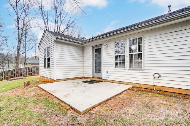 rear view of house with a patio area and a yard