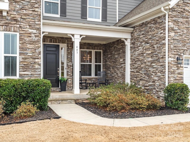 property entrance featuring covered porch