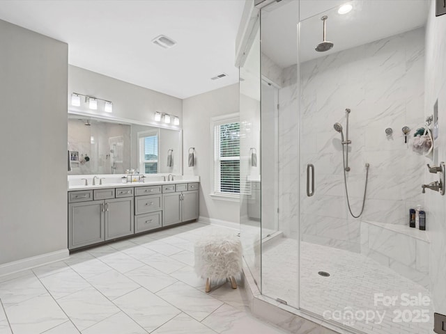 bathroom featuring an enclosed shower and vanity