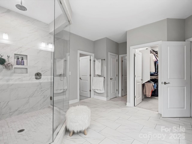 bathroom with a tile shower