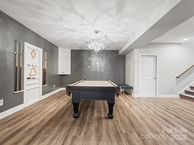 rec room featuring hardwood / wood-style flooring, pool table, and a chandelier