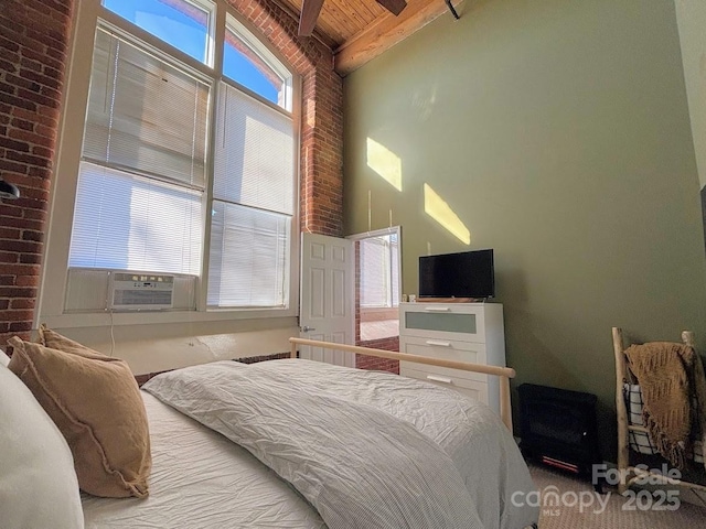 bedroom featuring beam ceiling, high vaulted ceiling, cooling unit, and wooden ceiling