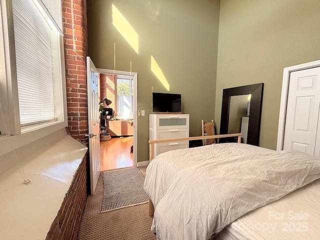 201 S Hoskins Rd Unit 136, Charlotte, NC 28208 - carpeted bedroom with a towering ceiling