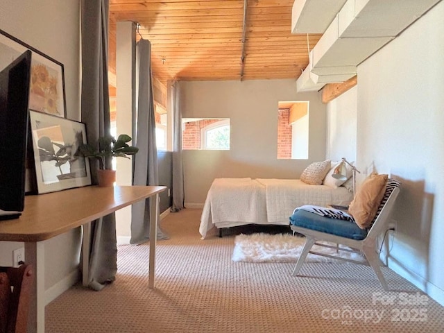 bedroom with light colored carpet and wood ceiling