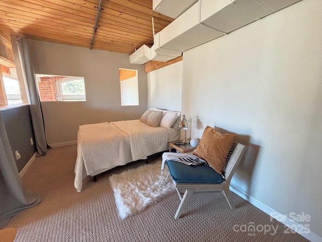 bedroom featuring carpet and wooden ceiling