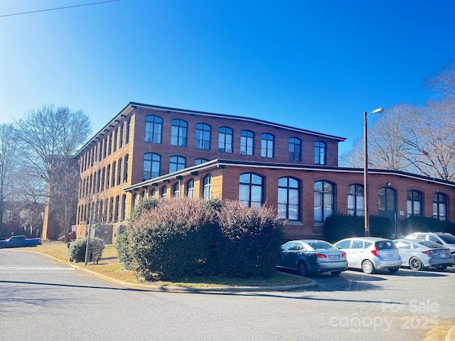 201 S Hoskins Rd Unit 136, Charlotte, NC 28208 - view of property with uncovered parking