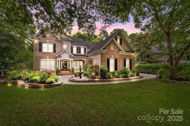 craftsman-style house featuring a yard