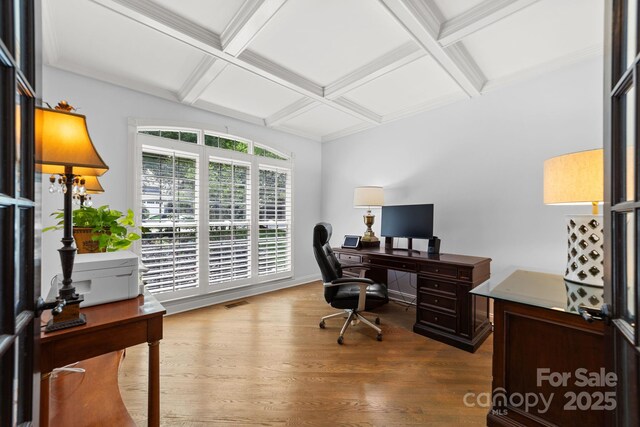 home office with beam ceiling, hardwood / wood-style floors, and coffered ceiling