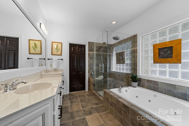 bathroom with vanity and separate shower and tub