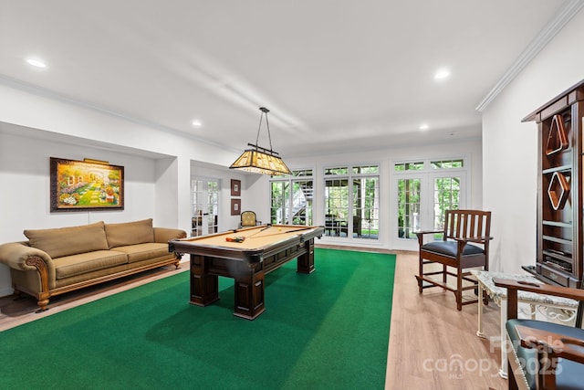 game room featuring french doors, hardwood / wood-style flooring, crown molding, and billiards