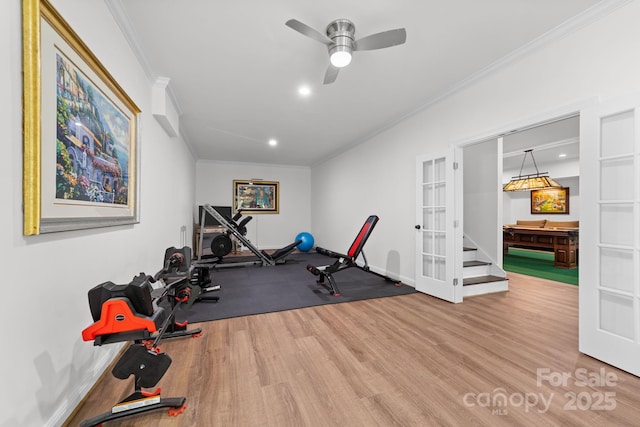 exercise area with ceiling fan, ornamental molding, and light hardwood / wood-style flooring