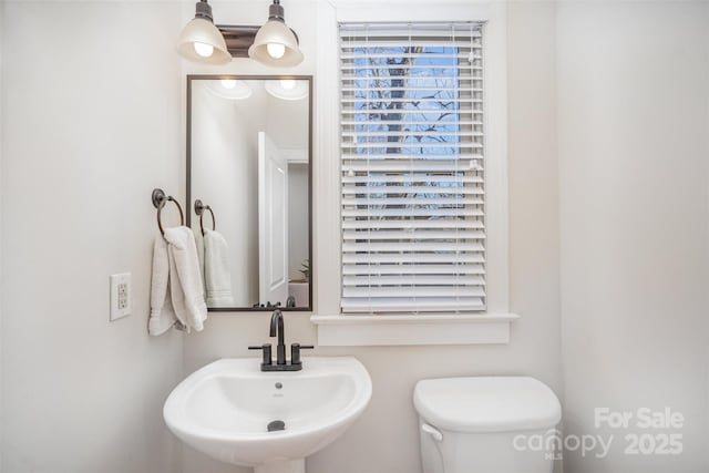 bathroom with toilet and sink