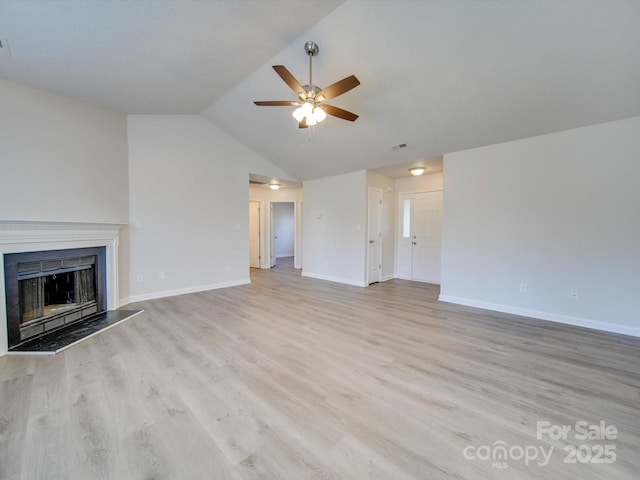 unfurnished living room featuring lofted ceiling, ceiling fan, and light wood-type flooring