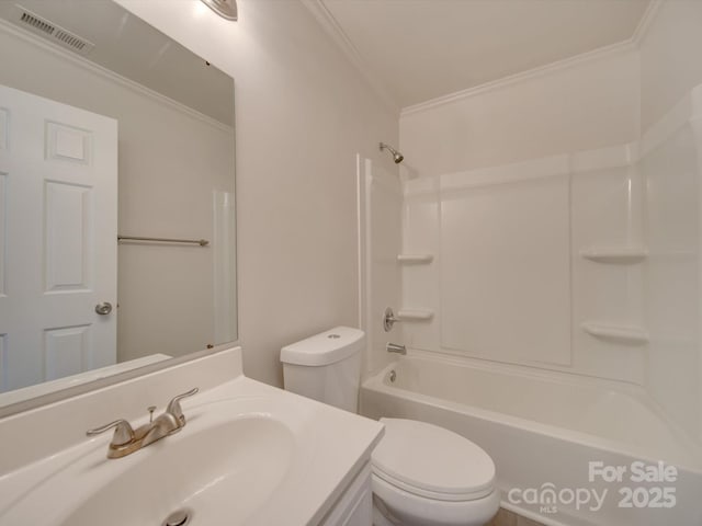 full bathroom with vanity, crown molding, toilet, and washtub / shower combination