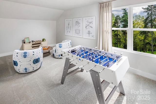 recreation room with carpet flooring and lofted ceiling