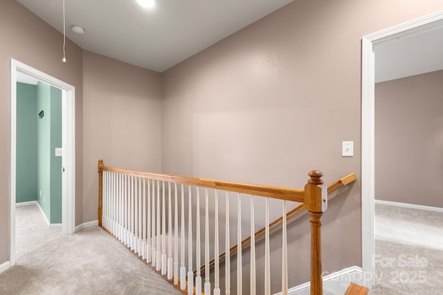 hallway featuring light carpet