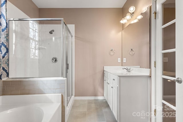 bathroom with tile patterned floors, vanity, and independent shower and bath