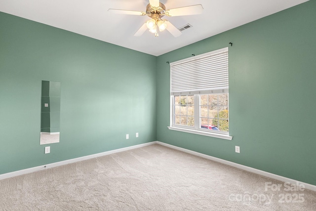 carpeted empty room with ceiling fan