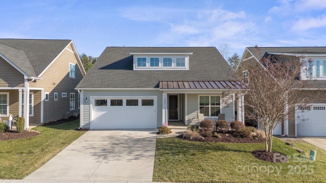 view of front of property featuring a garage, a front yard, and a porch