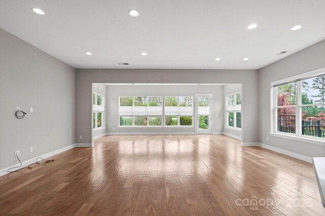 253 Stone Mountain Way, Denver, NC 28037 - unfurnished living room featuring light wood finished floors, baseboards, and recessed lighting