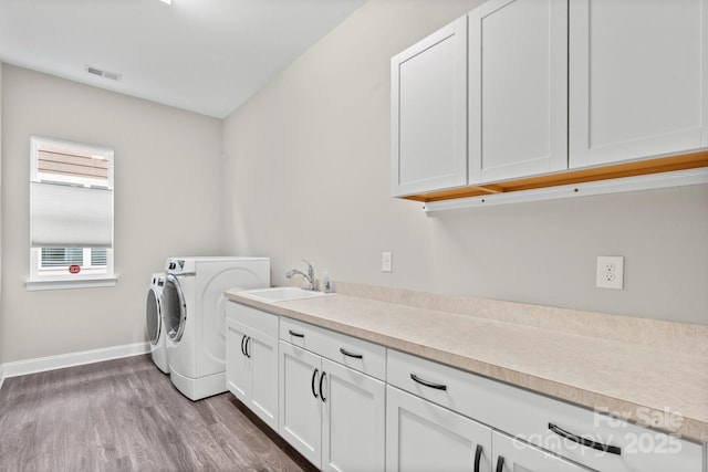 253 Stone Mountain Way, Denver, NC 28037 - laundry room with washer and clothes dryer, baseboards, cabinet space, and wood finished floors