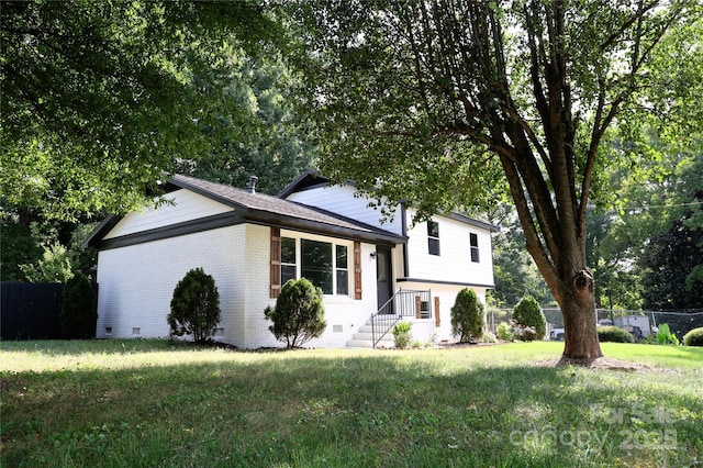 split level home with a front yard